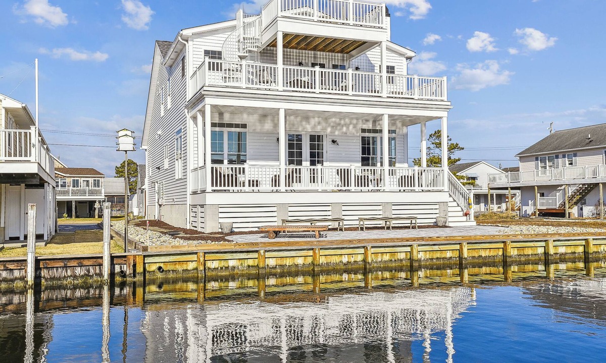 Fenwick Island House | Activities included up to $300 FREE PER WEEK! Exceptional waterfront custom vacation home is located on a canal in family friendly Fenwick Island