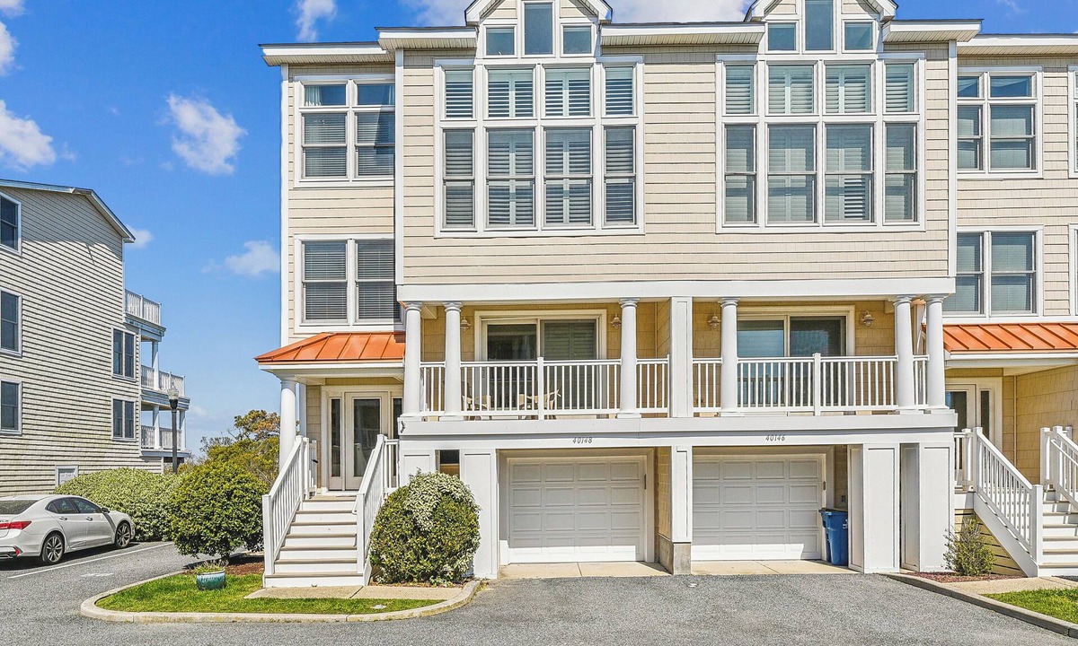 Fenwick Island House | Activities included up to $300 FREE PER WEEK! NEW LISTING 2024! Exceptional and spacious multi-level 4 bedroom plus den, 4 full bath townhome overlooking the bay offering panoramic views and glorious sunsets from any of the 3 open decks!