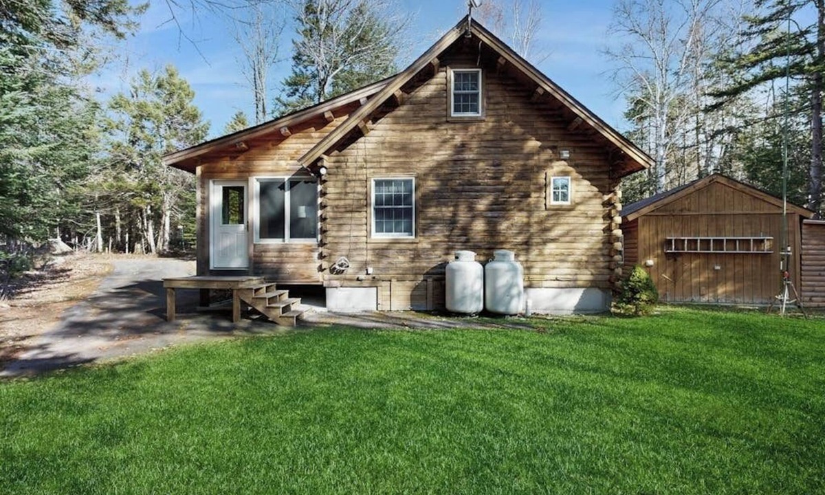Beaver Cove House | Cozy cabin with covered porch, firepit, grill, fireplace, & washer/dryer