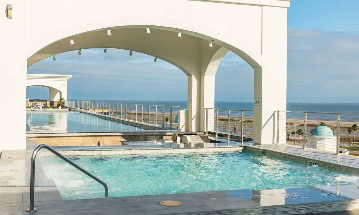 Galveston Apartment | Elegant gulf escape with heated pool, hot tub, beach access, & water views