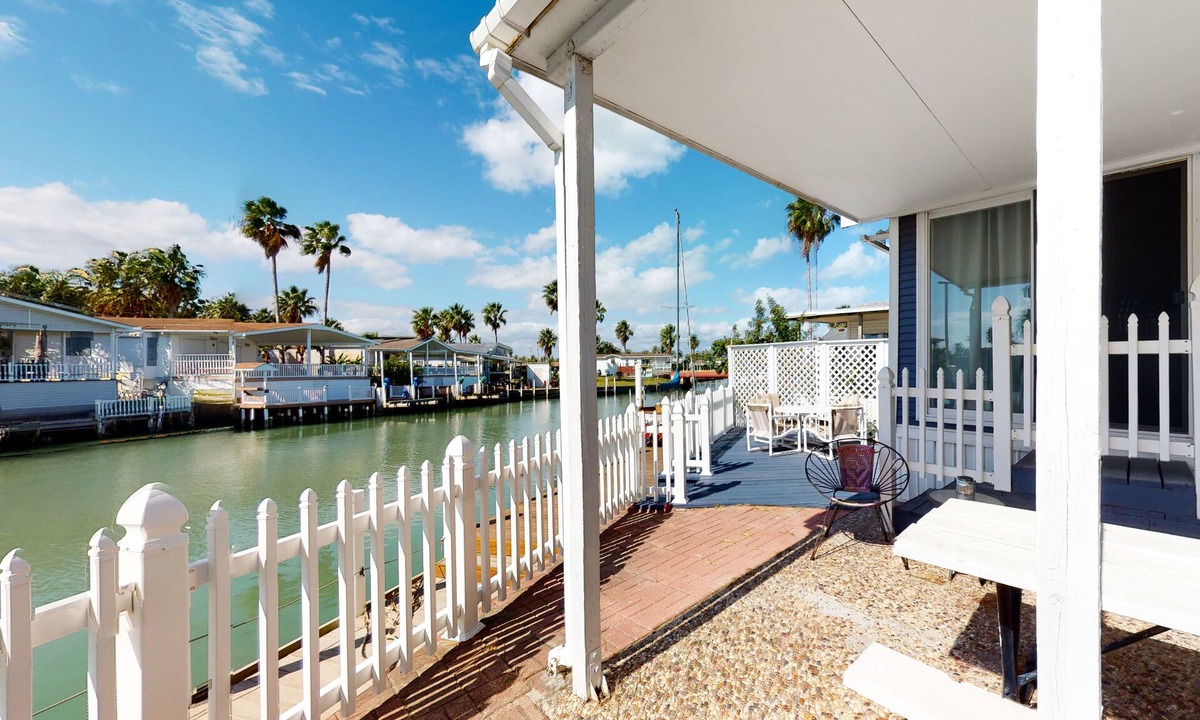 Port Isabel House | Perfect getaway on the canal w/ shared pool, outdoor seating, central AC & more
