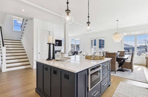 Fenwick Island House | Activities included up to $300 FREE PER WEEK! Exceptional waterfront custom vacation home is located on a canal in family friendly Fenwick Island
