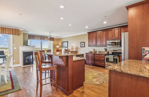 Fenwick Island House | Activities included up to $300 FREE PER WEEK! NEW LISTING 2024! Exceptional and spacious multi-level 4 bedroom plus den, 4 full bath townhome overlooking the bay offering panoramic views and glorious sunsets from any of the 3 open decks!
