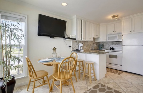 Galveston Condo | Beach Cottage steps from Surf. fishing. the Beach and Serene Sunsets (1303)