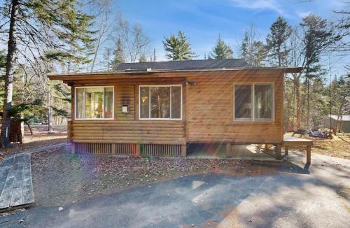Beaver Cove House | Cozy cabin with covered porch, firepit, grill, fireplace, & washer/dryer