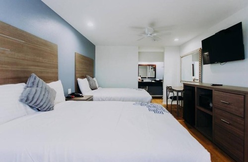 Clear Lake Shores Hotel | Family Stay Right off Route 146 | Relax at Deck with Marina Views