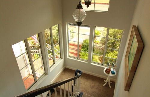 Encinitas House | Impeccable Cape Cod Oceanfront Home Overlooking Swami's Beach.