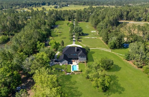 Waverly House | Luxury 7 bedroom mansion with horses, pool, hot tub, pond, swings and fire pit!