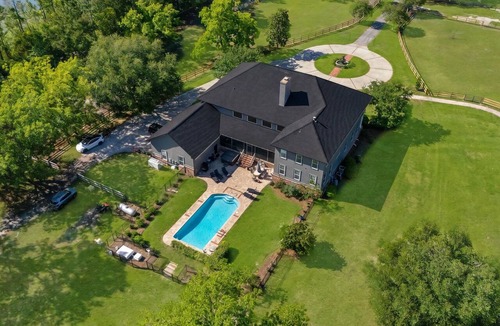 Waverly House | Luxury 7 bedroom mansion with horses, pool, hot tub, pond, swings and fire pit!