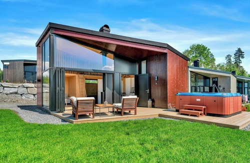 Nes Municipality House | Modern comforts and river views at Oppaker