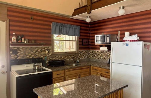 Rangeley Plantation Cabin | Peaceful, Secluded Waterfront Cottage with Sandy Beach