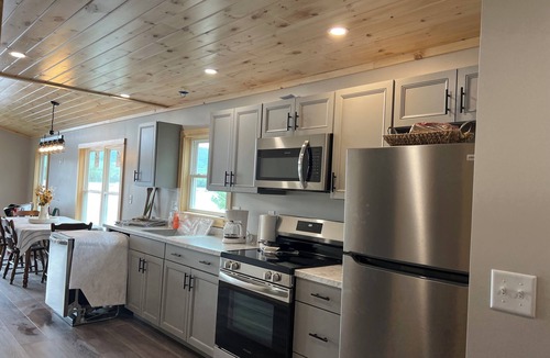 Brownville Cottage | Snowmobiler & Ice Fishing Paradise right on the water with mountain views!