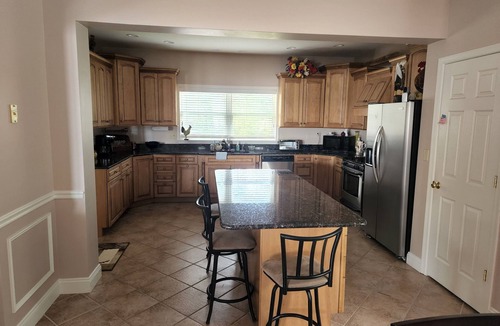 Rehoboth Beach House | Waterfront home with dock, gazebo, and fenced yard