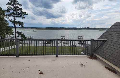 Rehoboth Beach House | Waterfront home with dock, gazebo, and fenced yard