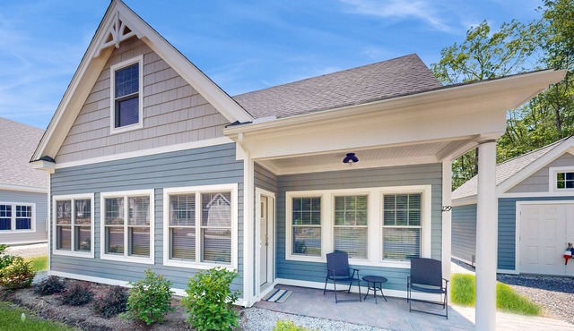 Charming cottage on a preserve with fireplace, WiFi, W/D, pool, gym, & game room