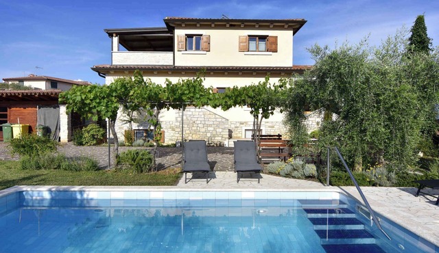 Holiday apartment with swimming pool and terrace in a residential complex near the sea