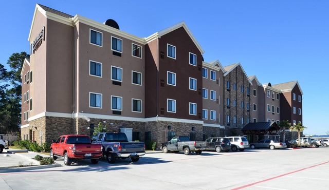 King Suite in Tomball | Shared Outdoor Pool + 24h Fitness Center