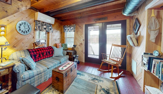 Lakefront cabin with screened porch, woodstove, & water access - dog-friendly