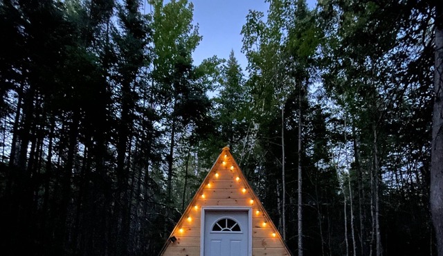 Off grid A-frame cabin nestled in the Maine woods