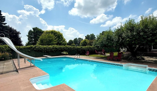 Spacious Farmhouse Retreat - pet friendly, pool, deck, Orchard views, and more.